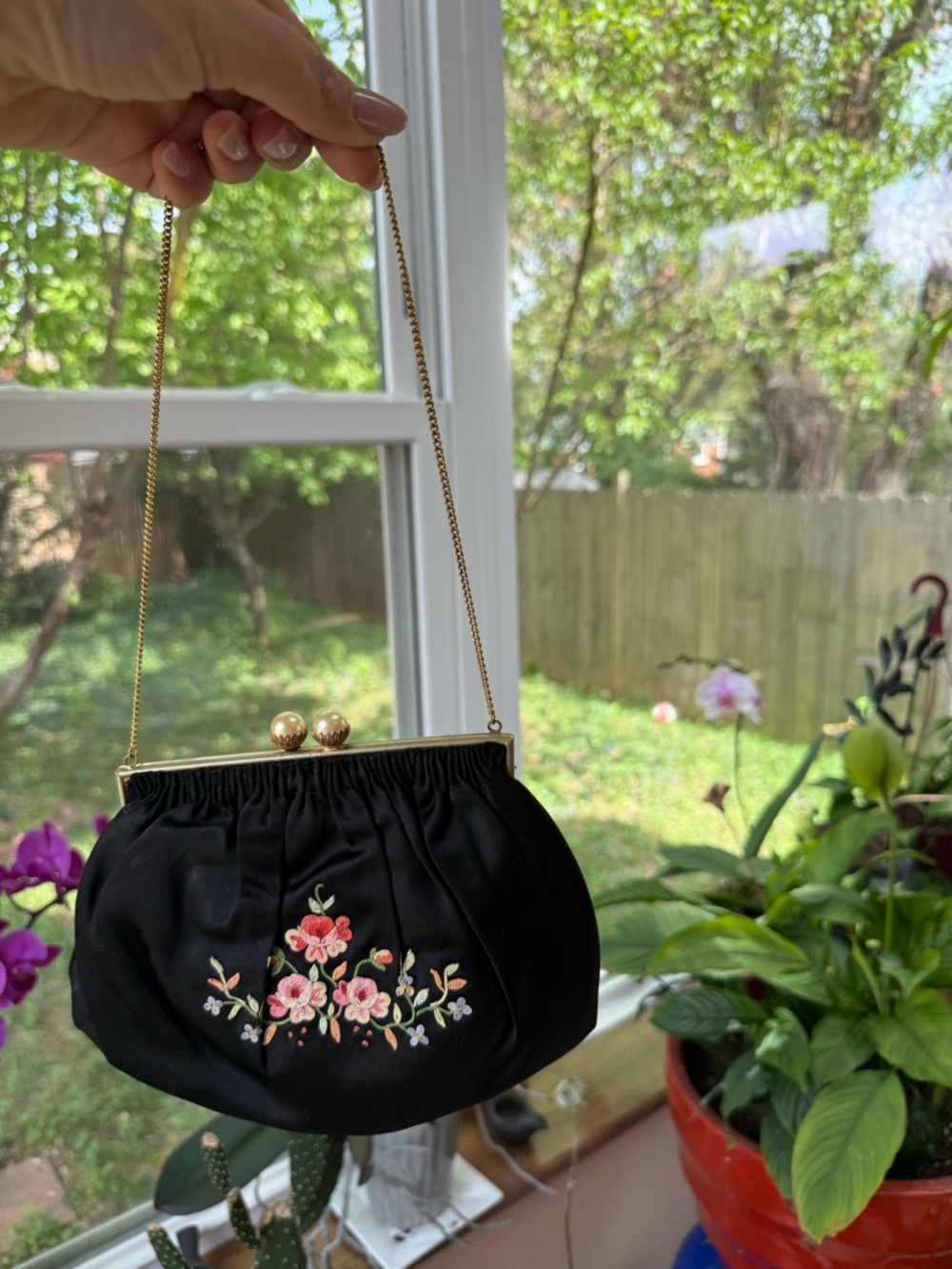 Vintage Black silky purse with floral embroidery and gold accents. Kiss lock.